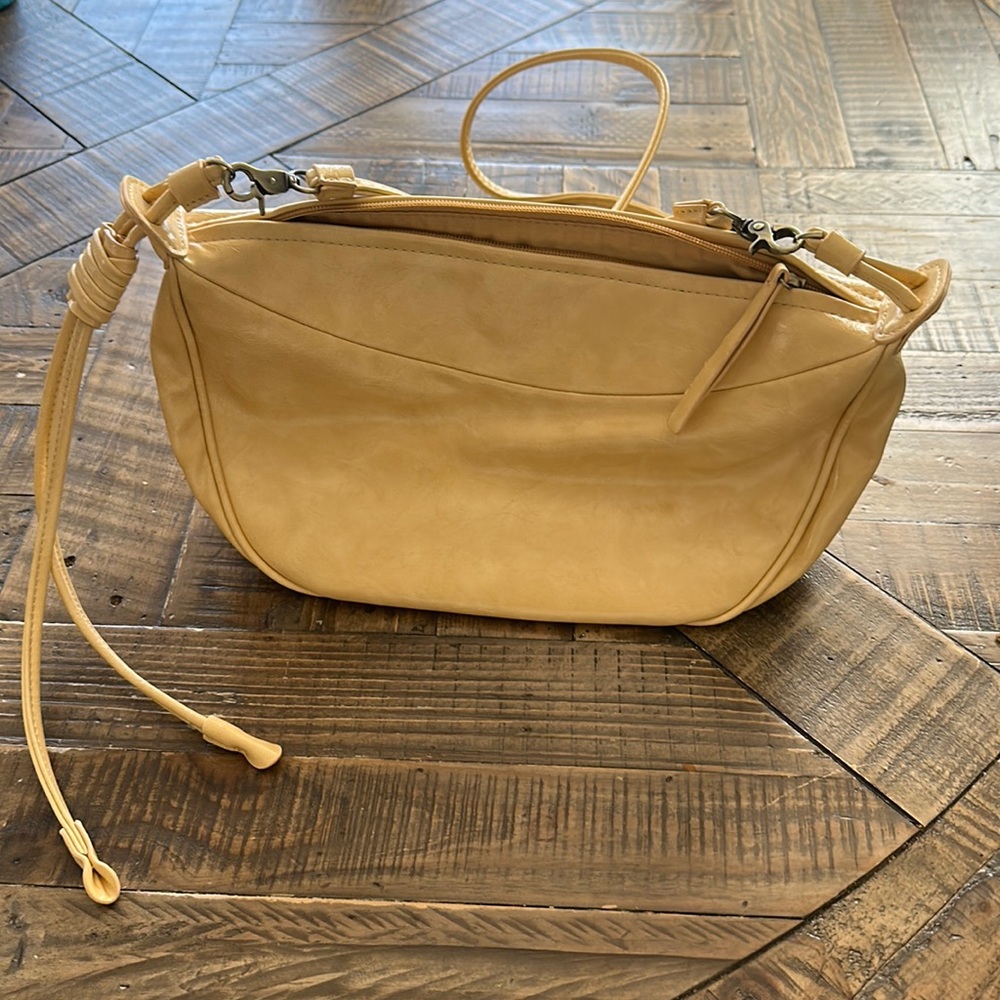 Anthropologie crossbody bag. Light yellow.
